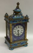 A brass mounted and enamelled carriage clock decor