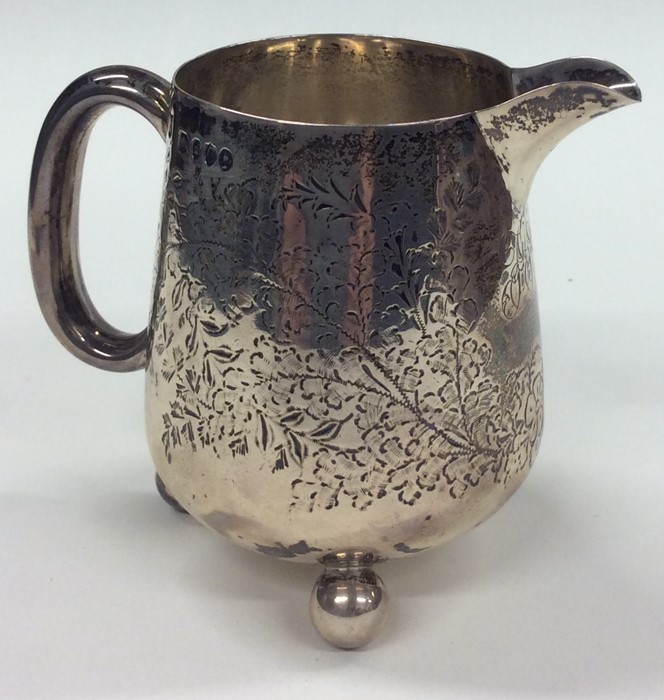 A Victorian silver cream jug decorated with flower - Image 2 of 2
