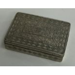 A rectangular Indian silver box decorated with flo