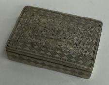 A rectangular Indian silver box decorated with flo