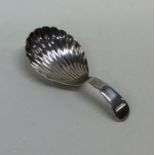 A Georgian silver caddy spoon with fluted bowl. Lo