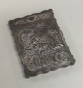 An Indian silver hinged top card case embossed wit