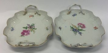 A pair of Meissen shallow baskets with floral deco