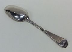 A Georgian silver dessert spoon with crested termi