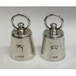 A rare pair of novelty silver pepper grinders of t