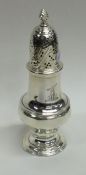 A Georgian baluster shaped silver caster with cres