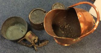 An old copper coal scuttle together with a brass b