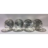 A rare set of eight George III silver dinner plate