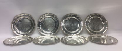 A rare set of eight George III silver dinner plate