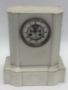 A large white marble mantle clock with striking mo