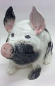 A massive Wemyss model of a pig with pink snout. A