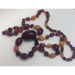 A good heavy graduated string of amber beads with