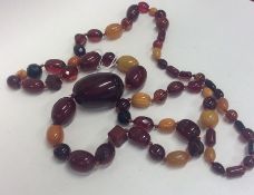 A good heavy graduated string of amber beads with