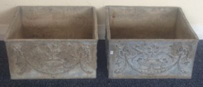 A pair of heavy lead square planters with floral d