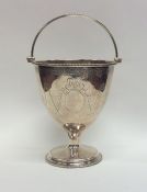 A good Georgian silver sugar basket with swing han