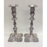 A good pair of Georgian style candlesticks with sc