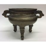 A large heavy bronze Chinese censer on tapering su