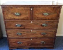 A Georgian flame mahogany four drawer secretaire c