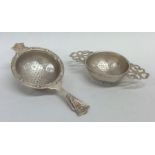 Two silver tea strainers. Approx. 71 grams. Est. £