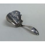 A Dutch silver bright cut caddy spoon of tapering