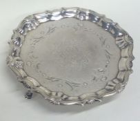 A Georgian silver waiter attractively engraved wit