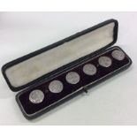 A boxed set of six stylish silver buttons. Birming