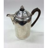 A good Georgian Irish silver water jug with creste