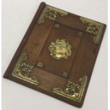 A 19th Century wooden book cover with brass onlays