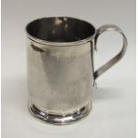 A good Georgian silver tapering mug on spreading b