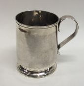 A good Georgian silver tapering mug on spreading b