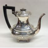 An Edwardian silver half fluted coffee pot on ball