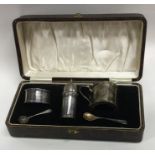 A cased three piece silver cruet set of plain desi