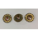 An attractive set of three buttons with porcelain