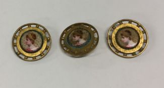 An attractive set of three buttons with porcelain