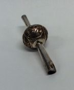 A Chinese silver rattle engraved with lettering. A