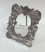 An Antique Japanese silver frame decorated with bi