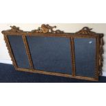 A good gilt triple mirror with scroll decoration.