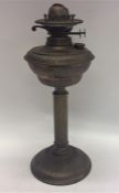 A brass mounted oil lamp on fluted base. Est. £30