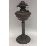 A brass mounted oil lamp on fluted base. Est. £30