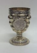 An unusual Continental silver gilt cup on tapering