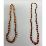 A string of faceted amber beads. Est. £50 - £80