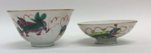 An Oriental tea bowl and cover decorated with drag