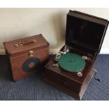 An old Alba travelling record player together with a case