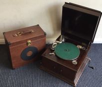 An old Alba travelling record player together with a case