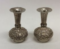 A pair of heavy Indian silver tapering spill vases