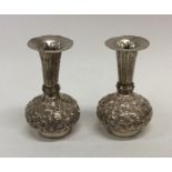 A pair of heavy Indian silver tapering spill vases