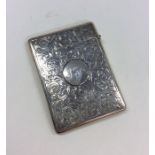An attractive silver scroll decorated card case wi