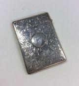 An attractive silver scroll decorated card case wi