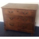 A bachelor's chest of three drawers with brass han