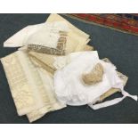 A selection of lace table cloths and place mats. E